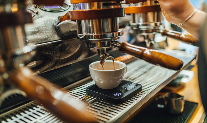  Lever coffee machine preparing delicious espresso with service.